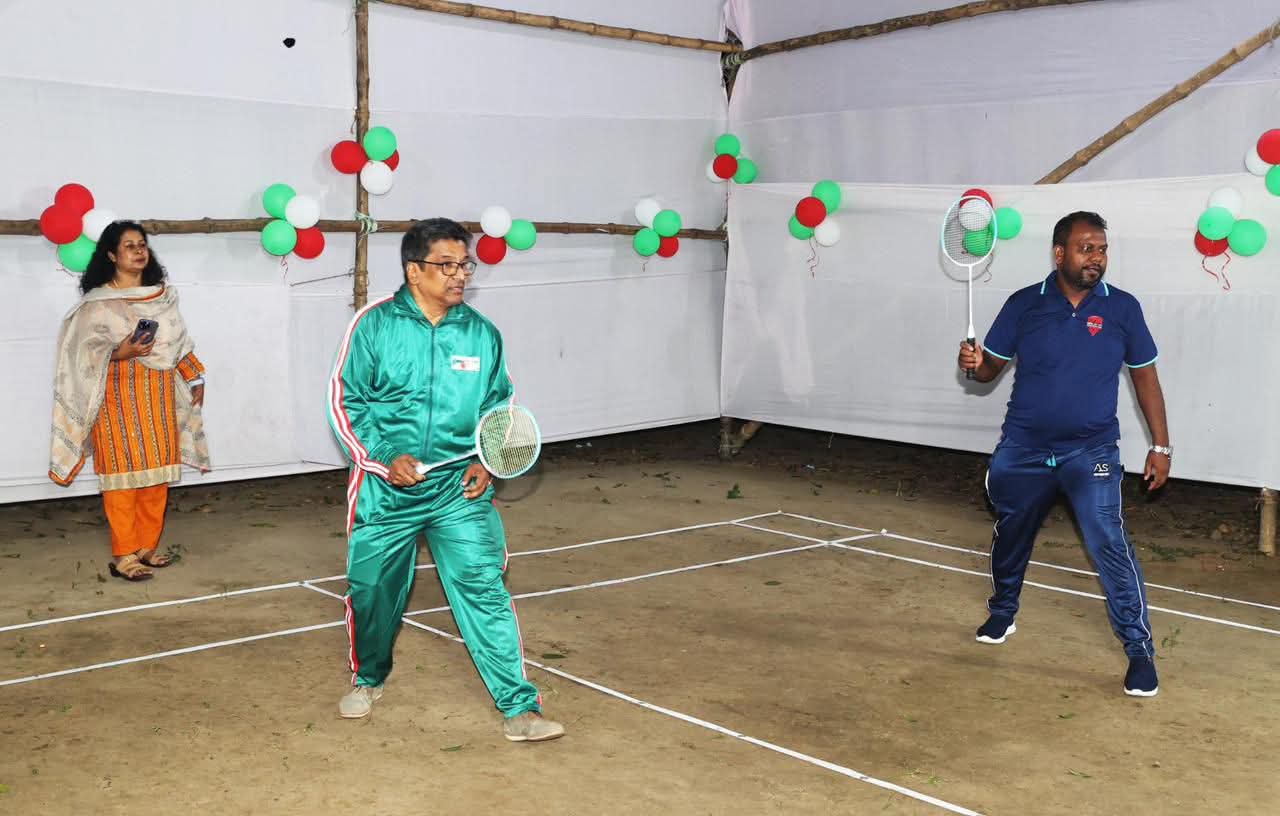 Two players mid-rally at an indoor sports event
